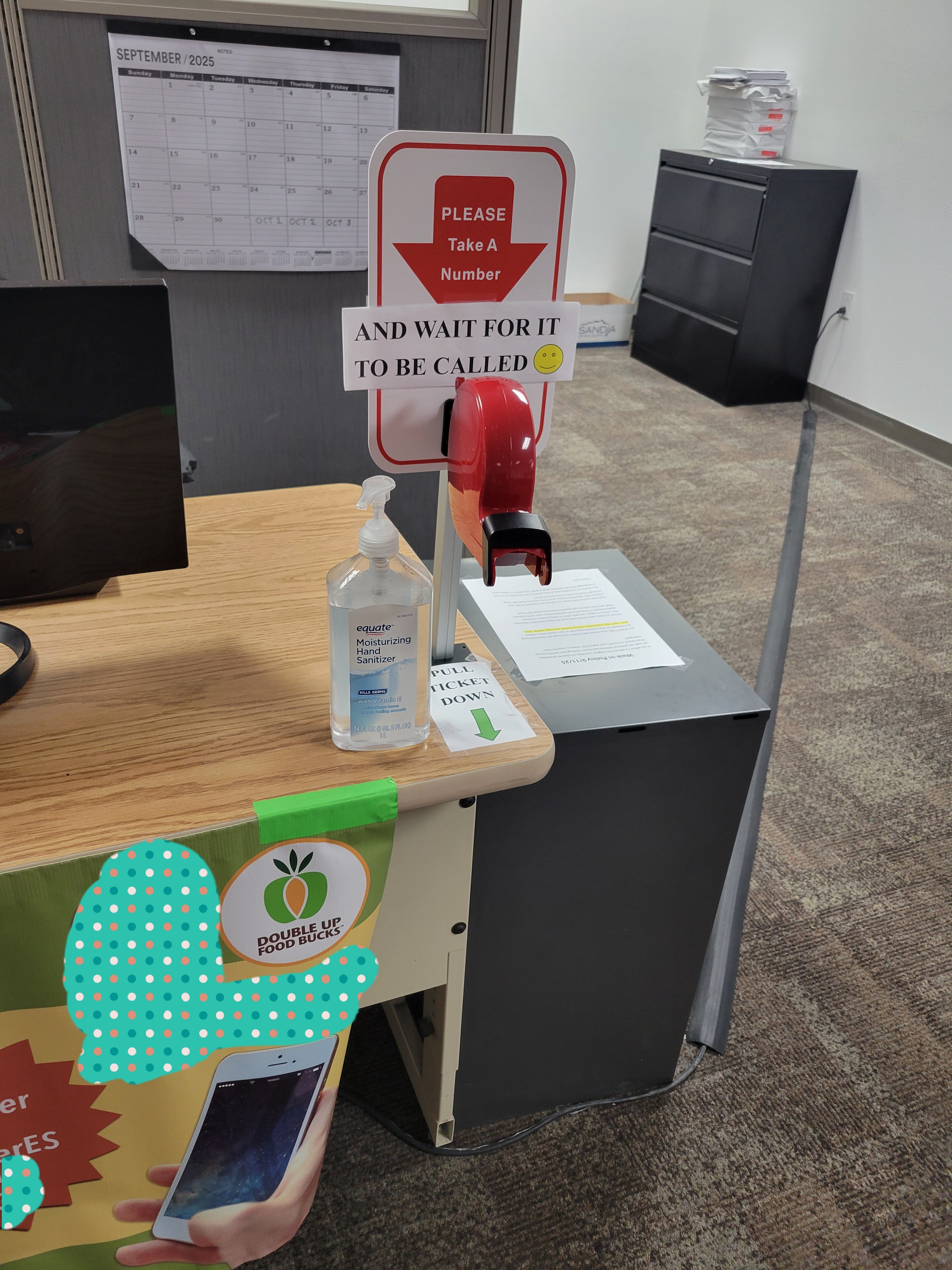 Paper number dispenser on a office desk.